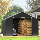 Grey 10x10 outdoor storage shed with stacked firewood and a lawnmower in a garden setting.