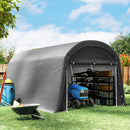 15 x 10ft Portable garage shed with storage shelves and gardening tools outdoors on a sunny day.