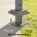 Anchor system with expansion screws for concrete and ground stakes for grass on a grassy background.