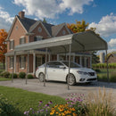A white sedan parked under a metal carport in front of a brick house with a lawn and flowers in the foreground.