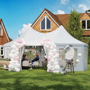 Decorated outdoor event with white peaked tent and pink balloons, chairs, and a house in the background.