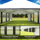 Outdoor canopy tent with transparent windows and zipper doors on a grassy field.