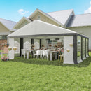 20 x 20 Outdoor gazebo tent with tables and chairs set up under it on a grassy area.