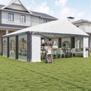 White outdoor canopy tent 20 x 20 with decorative elements in a backyard setting.