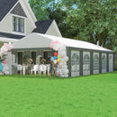 20 x 33 Outdoor event tent setup with a white canopy, balloons, and tables under a house.