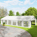 White 20 x 40 outdoor party tent on a grassy area with trees in the background