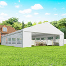 23 x 39 Large White Canopy Tent For Weddings, Party Tent on a grass field with tables and chairs inside for guests. 