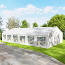 23 x 39 White Canopy Tent For Weddings, Party Tent with removeable walls on a grassy area with trees in the background