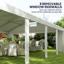 Outdoor event setup with a large white tent and removable window sidewalls.