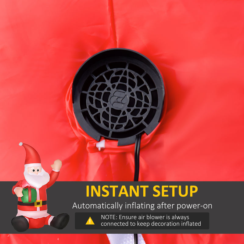 Black air blower on a red background with a cartoon Santa Claus figure and text about instant setup.