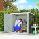 5x3ft Outdoor storage shed with open doors, filled with gardening tools and supplies, against a green fence and blue sky.