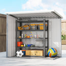 Small storage shed with shelves filled with tools and sports equipment on a clear day.