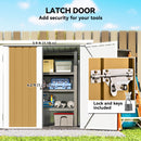 Tan coloured storage shed with open latch door showing tools inside, labeled dimensions and lock details.