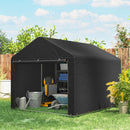 Black portable outdoor storage shed for tools and equipment with gardening tools on a grassy area