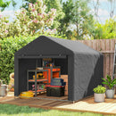 Portable storage shed with tools and supplies on a wooden deck in a garden setting.
