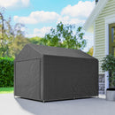 7x8ft portable storage shed outdoors in front of a house with greenery.
