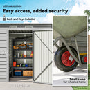 Storage shed with lockable door, tools inside, and a small ramp for wheeled items.