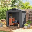Gray outdoor portable storage shed with tools and equipment on a wooden deck