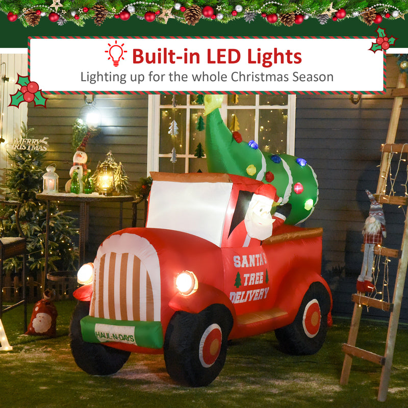Large Christmas inflatable display Santa Tree Delivery truck with built-in LED lights in a festive outdoor setting.