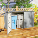 Metal outdoor trash bin storage shed with two trash cans inside on a wooden deck.