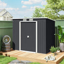7x4 grey metal garden shed with a wooden deck in a backyard setting.
