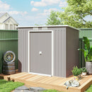 7x4 gray metal storage shed with a wooden deck in a backyard setting.