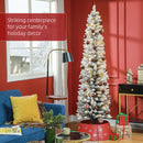 Decorated Skinny Christmas tree in a living room with red walls and festive decor.