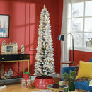Skinny Frosted Christmas tree in a living room with red walls and decorative items.