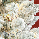 Frosted Christmas tree with white snow-like texture against a red background