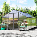 8 x 16 Greenhouse with plants and gardening tools on a sunny day
