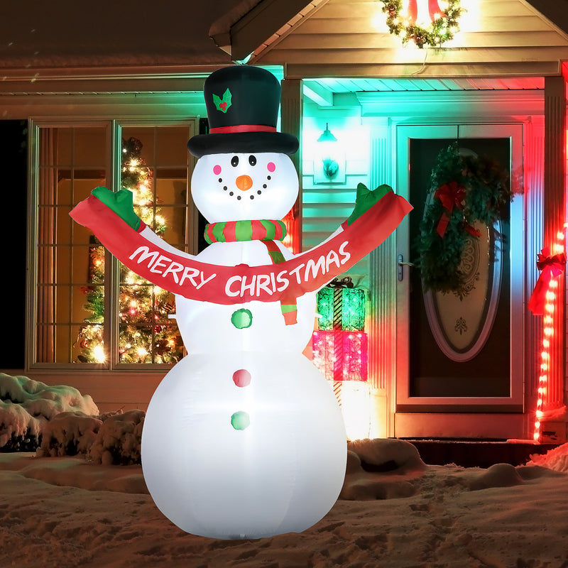 Inflatable snowman with a 'Merry Christmas' scarf in front of a festively decorated house.
