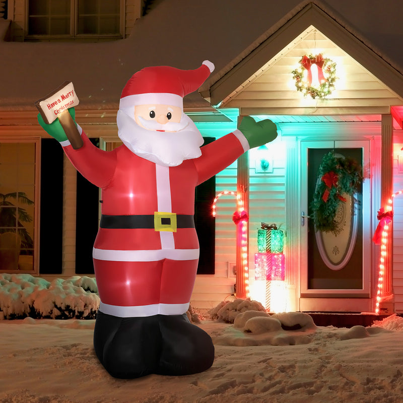8ft Inflatable Santa Clause with LED lights displayed on snowy front yard with other light up ornaments 