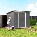 Gray 9x6.5 metal shed on a grassy backyard area