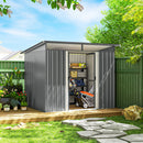 9x6.5ft garden shed for toys and bikes with open door on a wooden deck, surrounded by plants and trees.