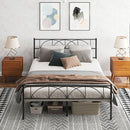 Bedroom with a queen size metal bed frame, wooden nightstands, and abstract wall art.