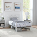 Twin size metal bedframe. White metal in a bright bedroom. 