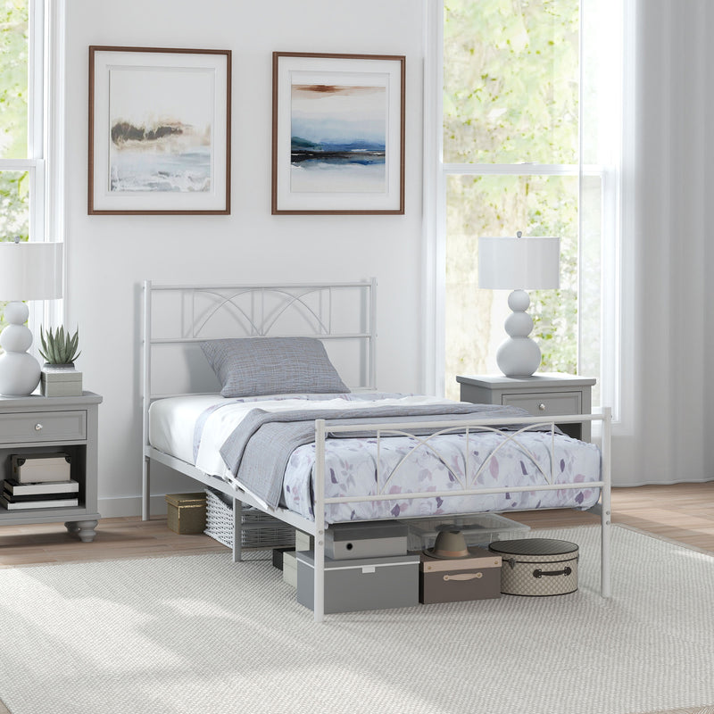 Twin size metal bedframe. White metal in a bright bedroom. 