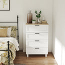 White dresser chest with wooden top in a bedroom setting