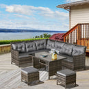 Outdoor patio furniture set with gray cushions on a wooden deck overlooking a scenic view.