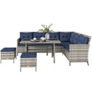 Outdoor furniture set with navy cushions on a white background