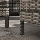 Woven stone wall with geometric pattern in an outdoor setting