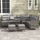 Outdoor patio furniture set with gray cushions on a stone patio.