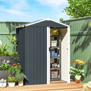 Dark gray small metal storage shed with plants and garden items in a backyard setting