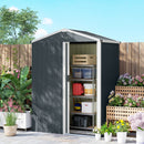 Small metal storage shed with open door in a garden setting