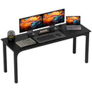 Black desk with computer setup including monitors, keyboard, and laptop on a white background