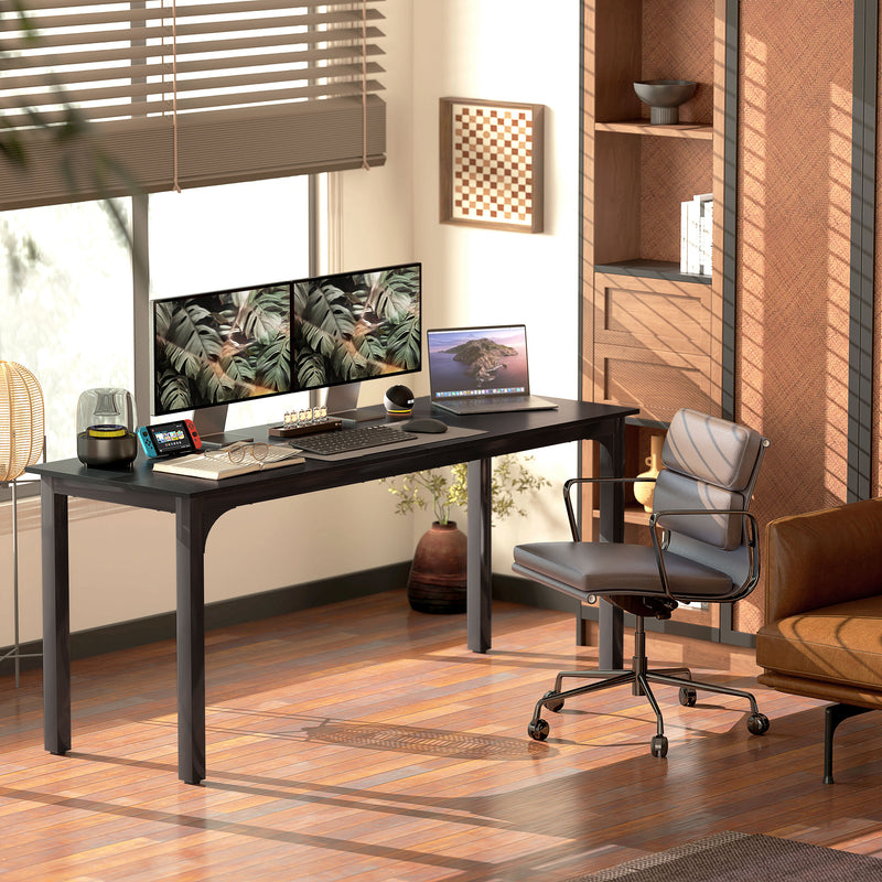 Modern home office with a desk, chair, and computer setup.