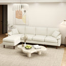 Cream White Sectional Sofa with reversible Chaise Lounge in a Livingroom Setting on a Chunky Rug