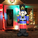 Giant inflatable Christmas display nutcracker decoration in front of a house with Christmas lights.