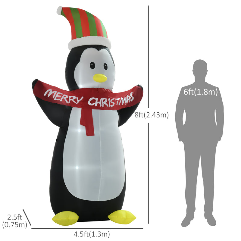 Giant Inflatable Christmas display penguin with Christmas hat and scarf, size comparison with a person.