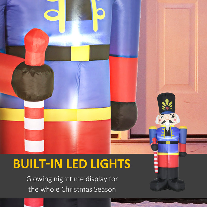 Inflatable nutcracker decoration with built-in LED lights on a wooden floor.